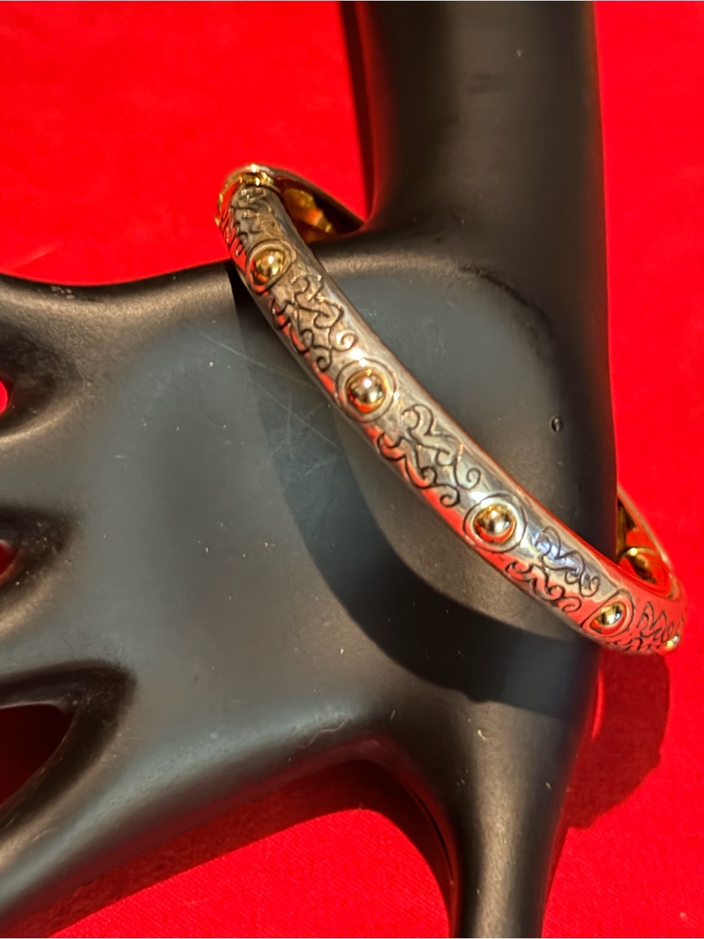 Gold-Tone Engraved Hinged Bangle Bracelet with Raised Stud Accents